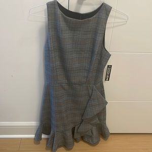 Size M. Over the knee light gray Plaid Dress with a ruffled skirt.